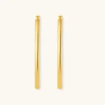 Set of geometric gold-plated sterling silver hoop earrings in oval and cushion shapes on cream background
