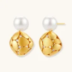 Gold-plated sterling silver drop earrings with white freshwater pearl studs and overlapping petal design with crystal accents