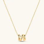 18K gold-plated 925 sterling silver letter N pendant on a delicate adjustable cable chain, cream background.
