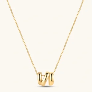 18K gold-plated 925 sterling silver letter N pendant on a delicate adjustable cable chain, cream background.