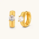 18K gold-plated 925 silver huggie hoops with brushed finish and prong-set round CZ solitaire, stamped S925 inside.
