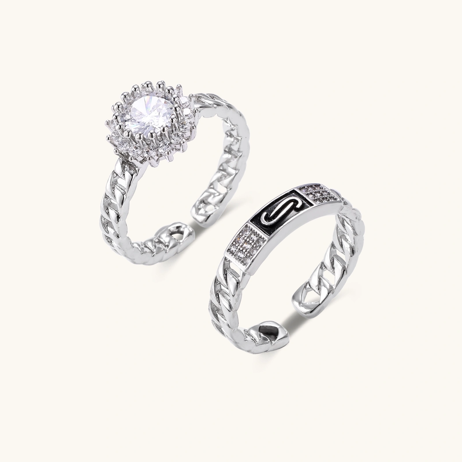 Two adjustable white gold plated rings with chain-link bands, featuring cubic zirconia halo and enamel details