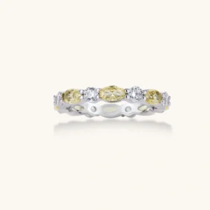 Platinum-plated copper ring with alternating clear and pale yellow oval stones in an eternity band design on white background.